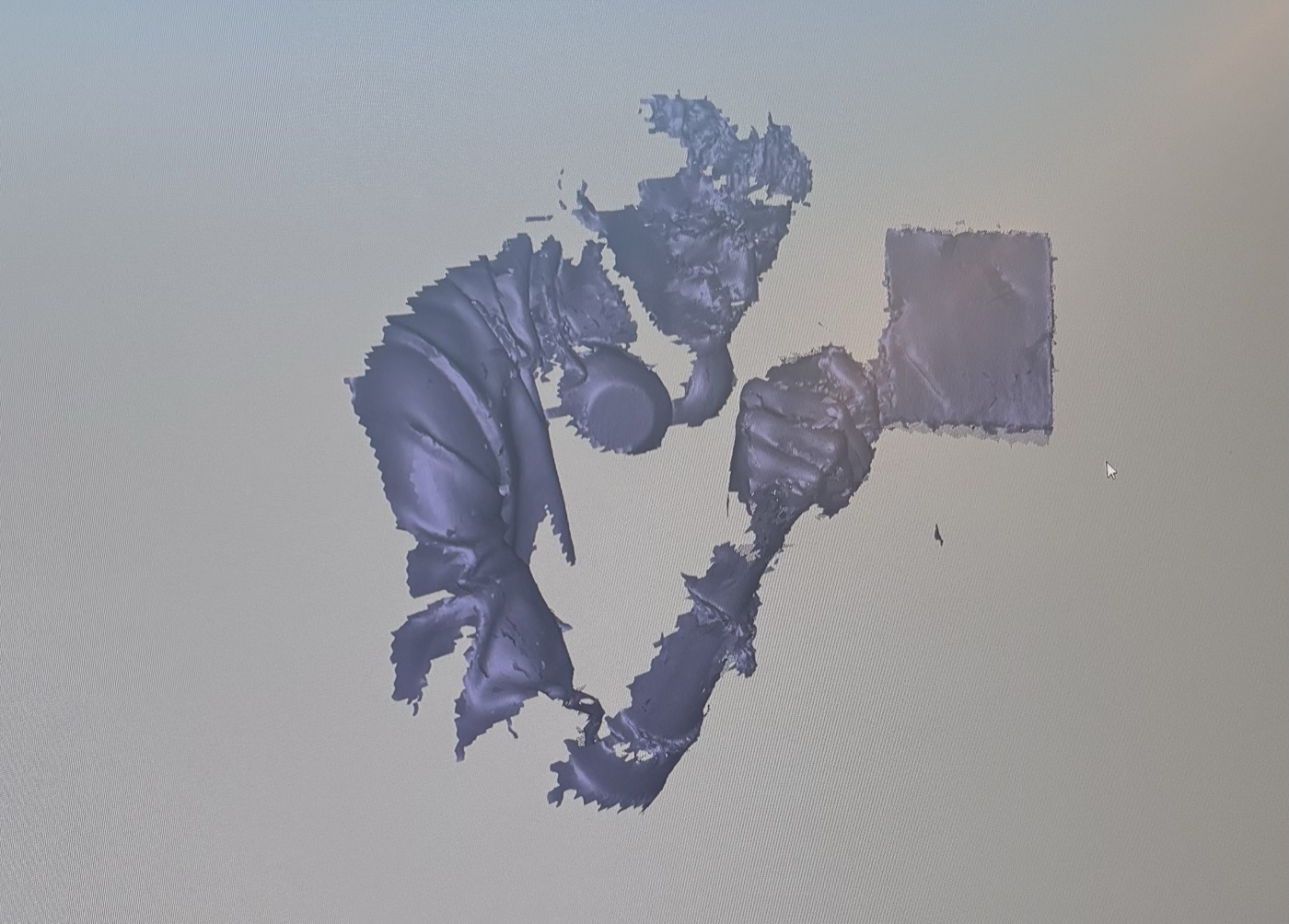 an early, mid-reconstruction gaussian splat scan of one of the tote prototypes, still full of holes and floating geometry